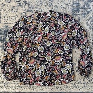 Black floral top with key hole, button back.